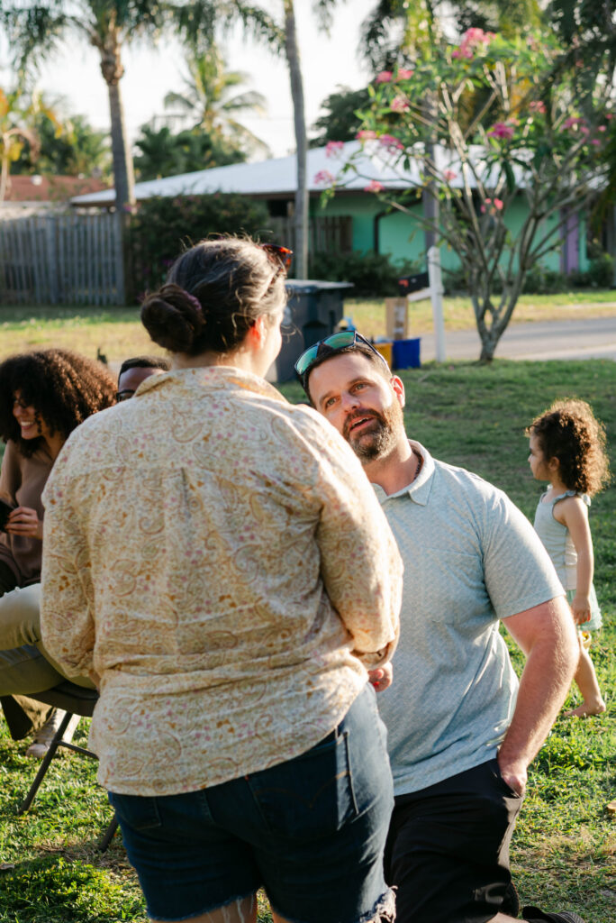 Backyard surprise proposal in West Palm Beach Florida with intimate family setting