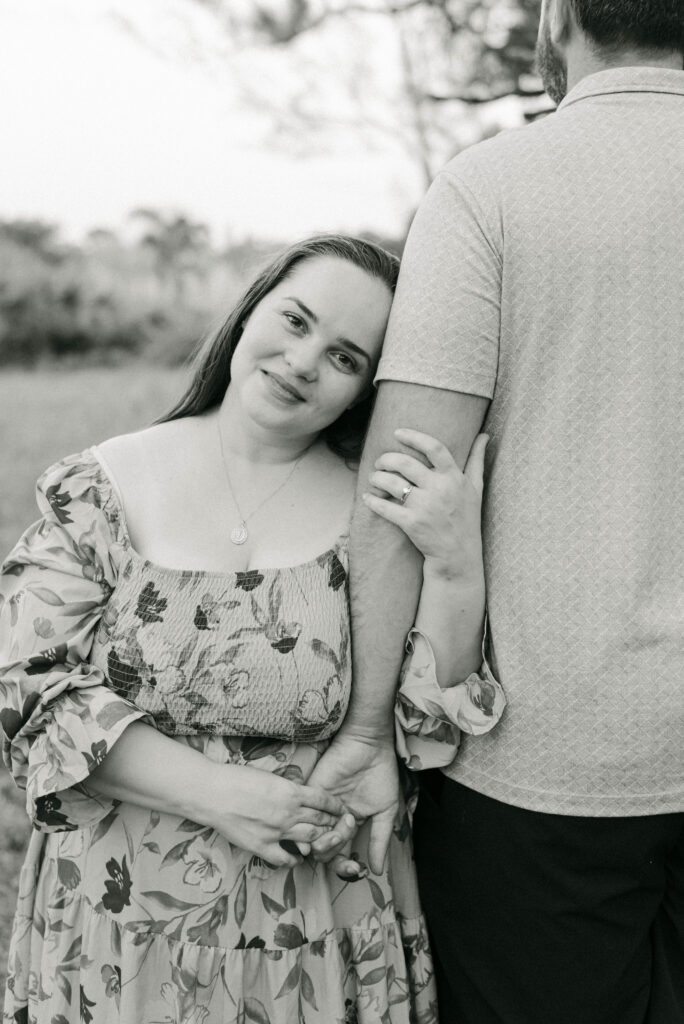 Backyard celebration of engagement in South Florida with candid couple portraits
