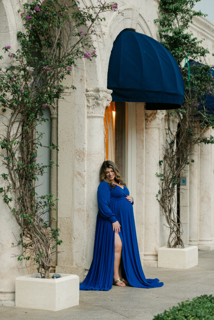 Side profile of pregnant woman smiling during golden hour