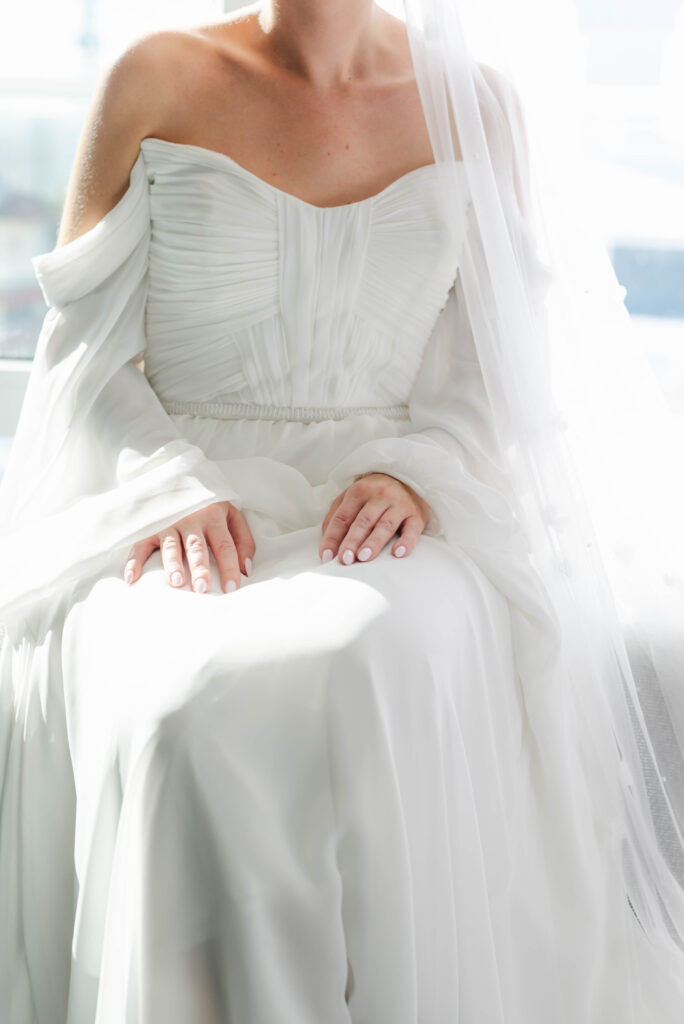 boho wedding dress the bride wore as she got ready with her girls at the courtyard delray beach hotel